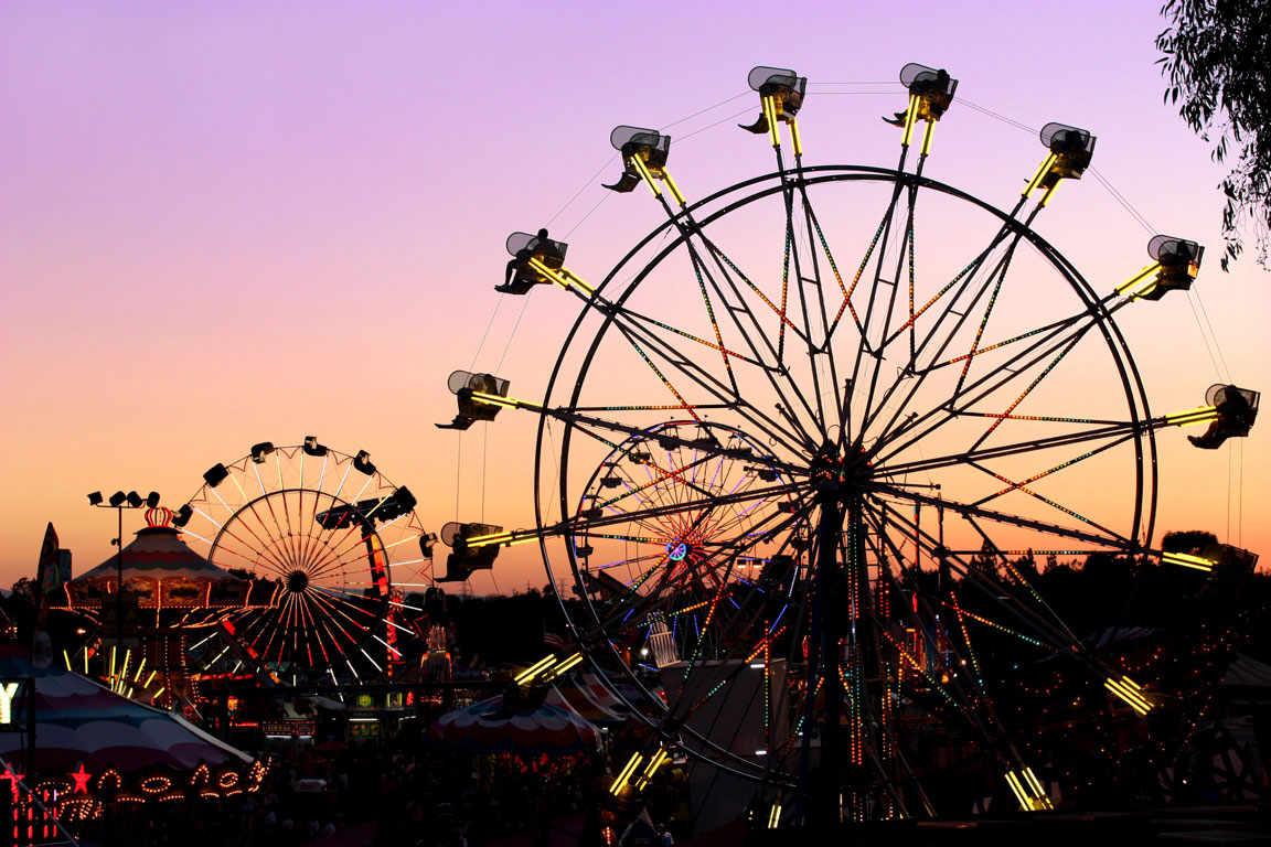 carnival rides in the sunset