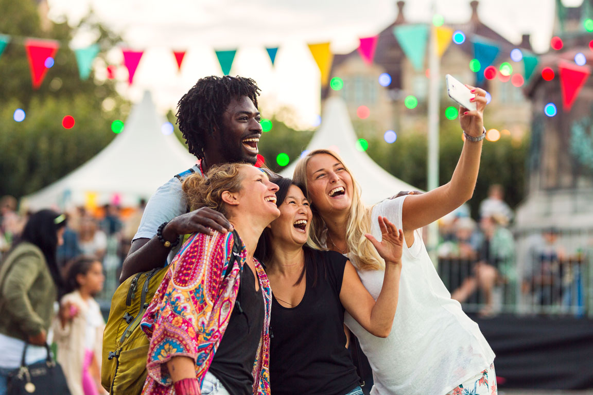 friends-taking-selfie-at-music-concert friends taking selfie at township day